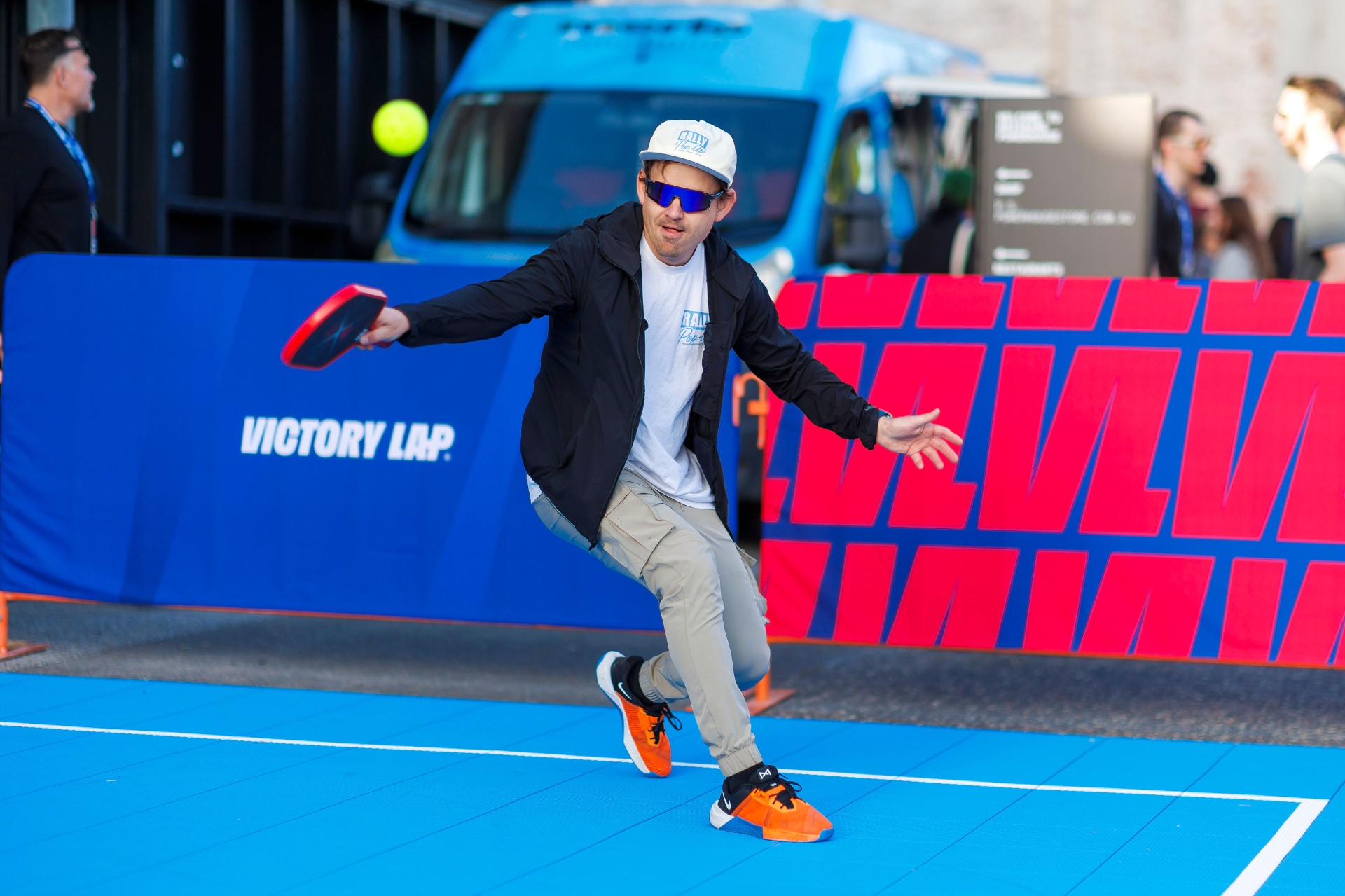 Player swinging on a Rally Pop-Up court
